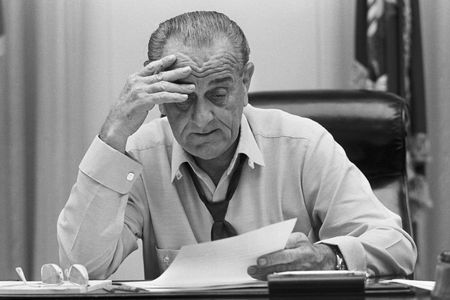 President Lyndon Johnson reviews a speech he will make about the Vietnam War, just weeks before the 1968 election.