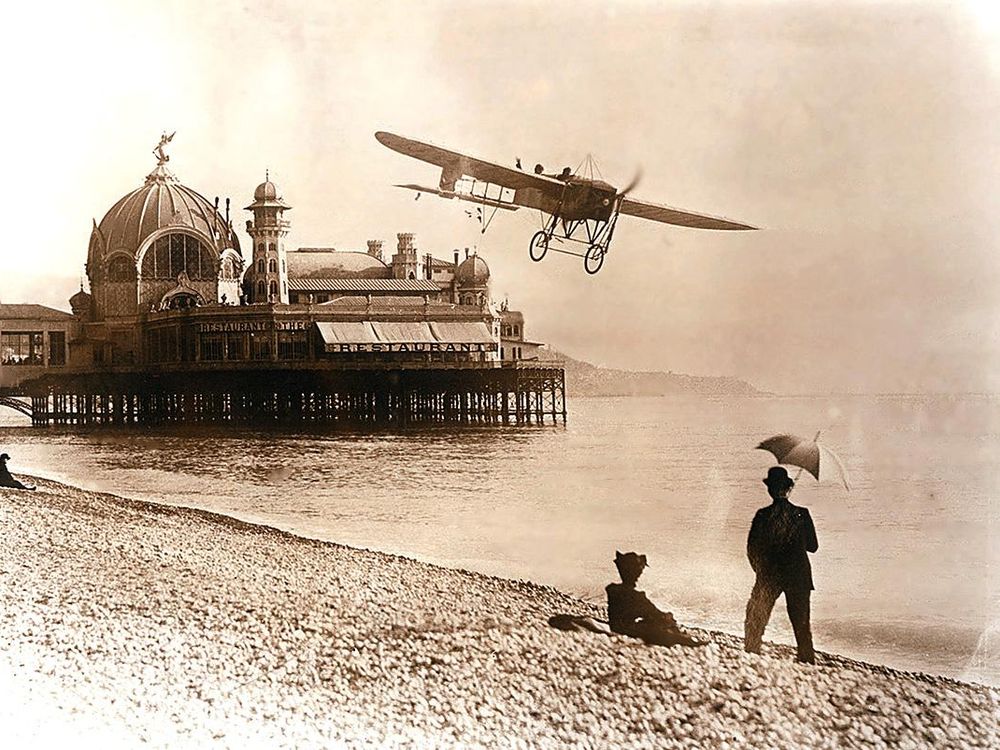 Bleriot XI-2 over a beach