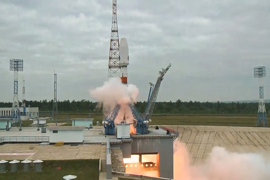 A video screenshot of a rocket launching from a platform on Earth