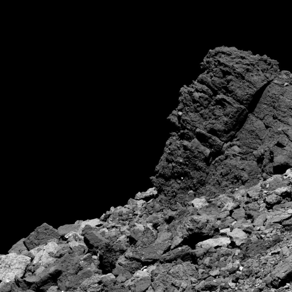 Rocky, gray surface of an asteroid.
