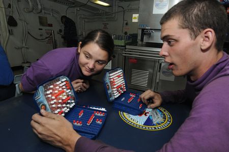 110930-N-VA840-013
ARABIAN SEA (Sept. 30, 2011) Airman Dyani M. Daniels, left, and Aviation Boatswain's Mate (Fuel) Airman Clayton W. Sahr play �Battleship� during a game tournament sponsored by the Morale, Welfare and Recreation (MWR) department aboard the aircraft carrier USS George H.W. Bush (CVN 77). George H.W. Bush is deployed to the U.S. 5th Fleet area of responsibility on its first operational deployment conducting maritime security operations and support missions as part of Operations Enduring Freedom and New Dawn. (U.S. Navy photo by Mass Communication Specialist 3rd Class Leonard Adams/Released)
