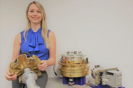 Surrounded by robotic tools for assembling satellites in space, Megan Smith looks forward to the day when a crewed habitat will orbit the moon.