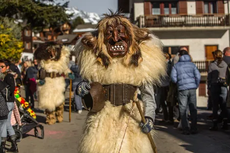 A&nbsp;L&ouml;tschental&nbsp;Valley resident dressed as a Tsch&auml;g&auml;tt&auml; strolls around the village of&nbsp;Wiler, in Valais, Switzerland moments before the annual Carnival Parade begins.