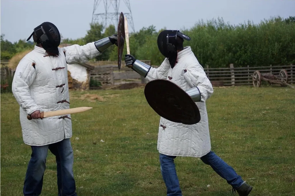 Scientists stage a sword fight
