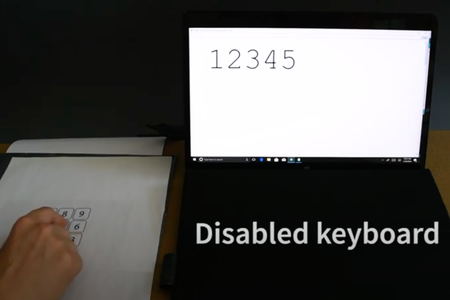 As the researcher taps the page, numbers appear on screen. 