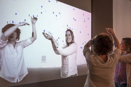 In Camille Utterback's 1999 Text Rain, viewers become part of the artwork.