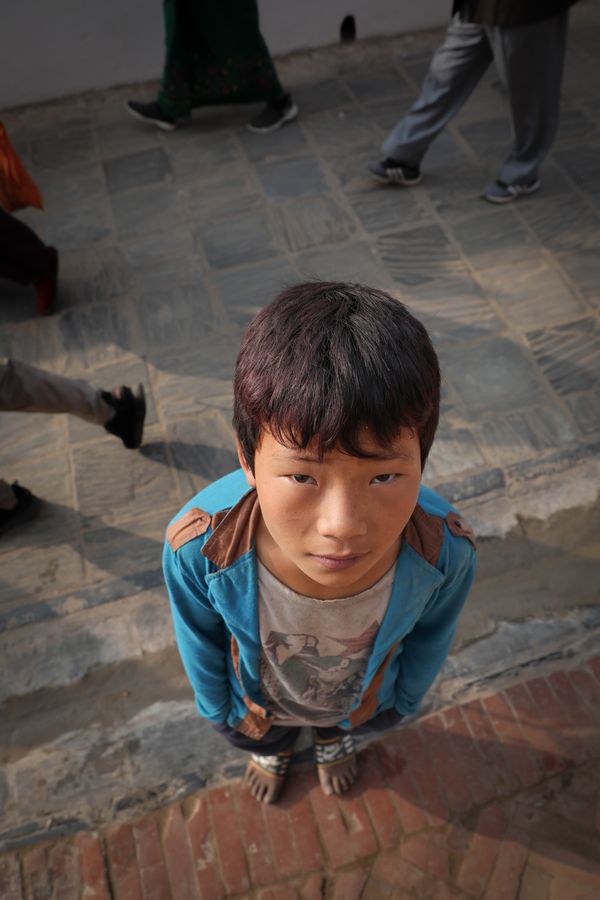 the barefoot and curious street kid that became my photographer's assistant thumbnail