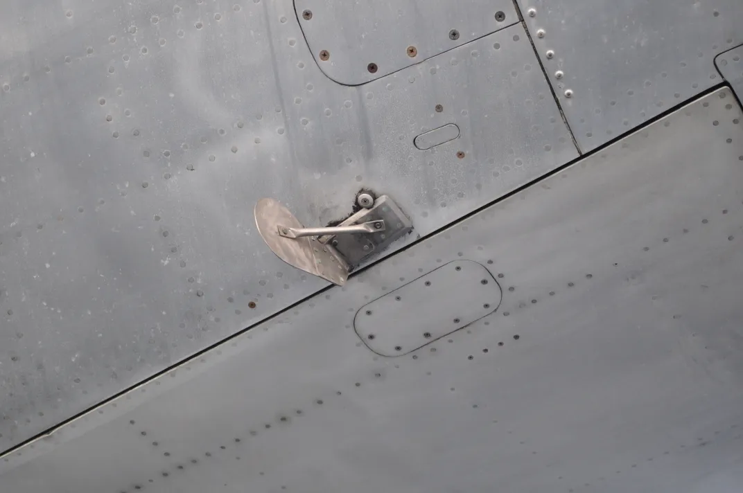 The Cooper vane—seen here—is a device that makes it impossible for aircraft to open their aft stairwells during flight.