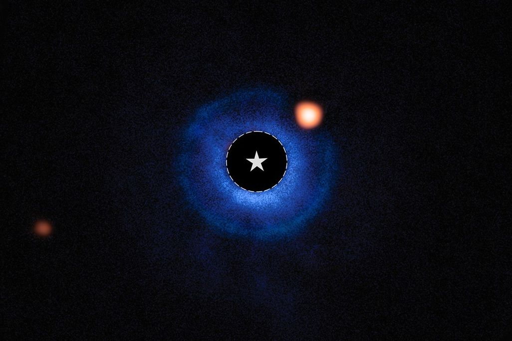 The potential exoplanet TWA 7 b is the orange circle within the blue debris disk.
