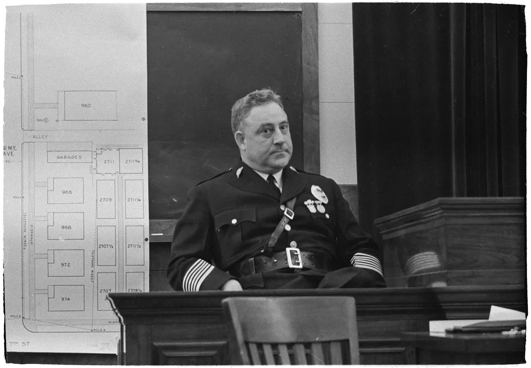 Los Angeles Police Chief James E. Davis testifying in front of a grand jury in 1938