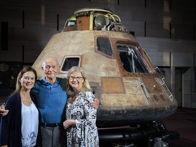 Michael Collins with daughters Ann (left) and Kate, next to his old ride at the National Air and Space Museum, June 14, 2016.