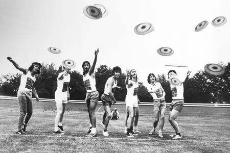 A group of Englishmen toss Frisbees in 1966.