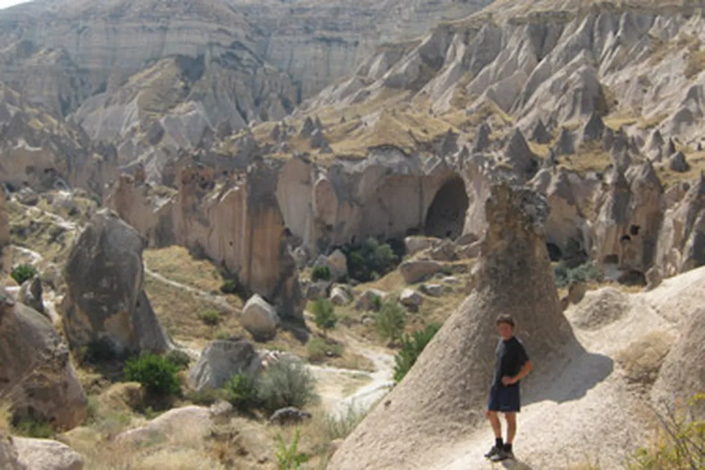 The author stands amidst weirdness in the Cappadocian village of Zelve.