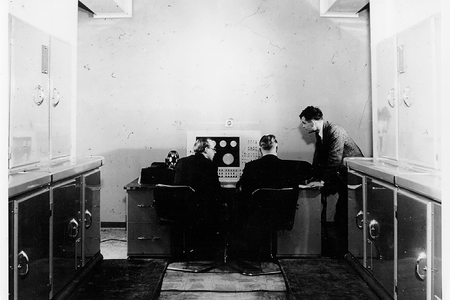 Turing standing next to the Mark I