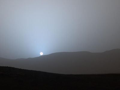 The Sun is seen setting through the Martian atmosphere by the Curiosity rover. Nighttime can bring turbulent snowstorms in the planet's atmosphere