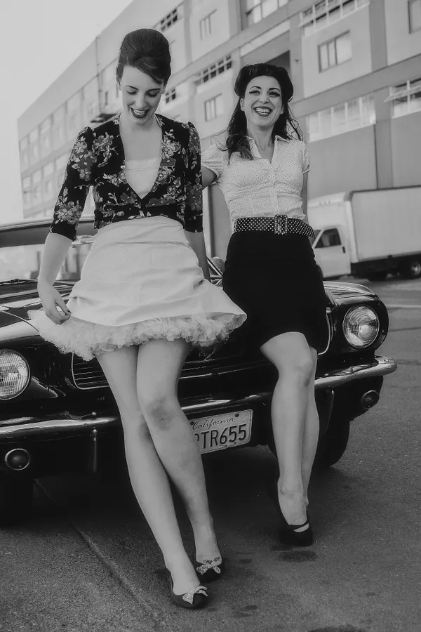 Two Women Leaning Against Car thumbnail