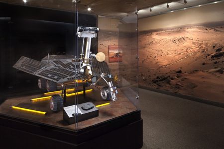 A full-scale Mars Exploration Rover, surrounded by one of its panoramic photos, is the centerpiece of a new exhibit.
