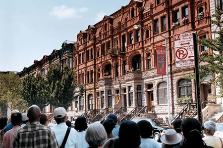 Stately architecture such as 1887 row houses on 122nd Street attract tour groups as well as tenants.