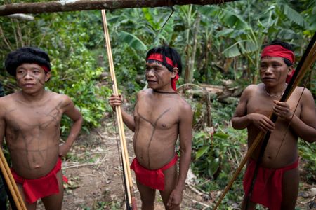 Several Yanomami at the community of Irotatheri, in Venezuela, wait to preform a dance for visiting journalists