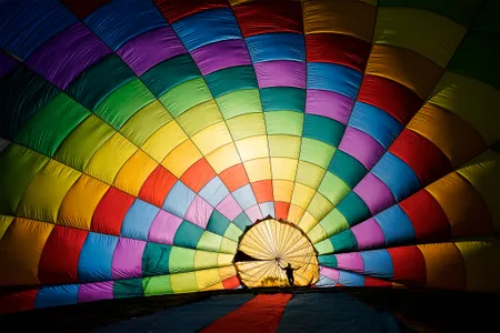 A worker prepares a hot air balloon during a festival in Ba Vi National Park, west of Hanoi, Vietnam.