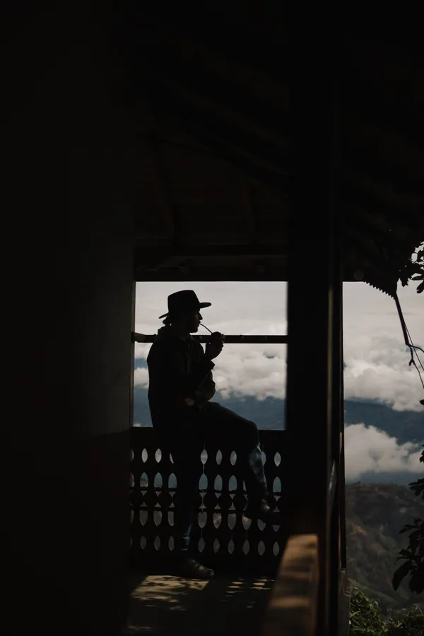 A young man contemplates in the Himlayas thumbnail