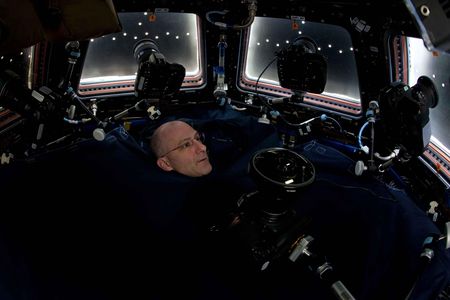 Don Pettit inside the International Space Station's cupola, all set up for a photo session.