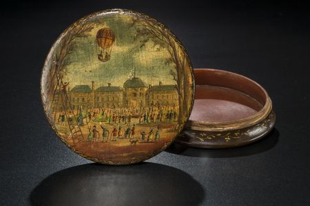 This 18th-century box is decorated with an image of J.A.C. Charles and M.N. Roberts rising above the Paris skyline in the first gas balloon to carry humans aloft, on December 1, 1783.