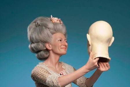 Madame Tussauds Berlin--one of the many Tussauds wax museums that bears Marie Tussaud's name--has a wax sculpture of Marie Tussaud herself. Here, she's portrayed sculpting the head of Ben Franklin (which is a thing she actually did).