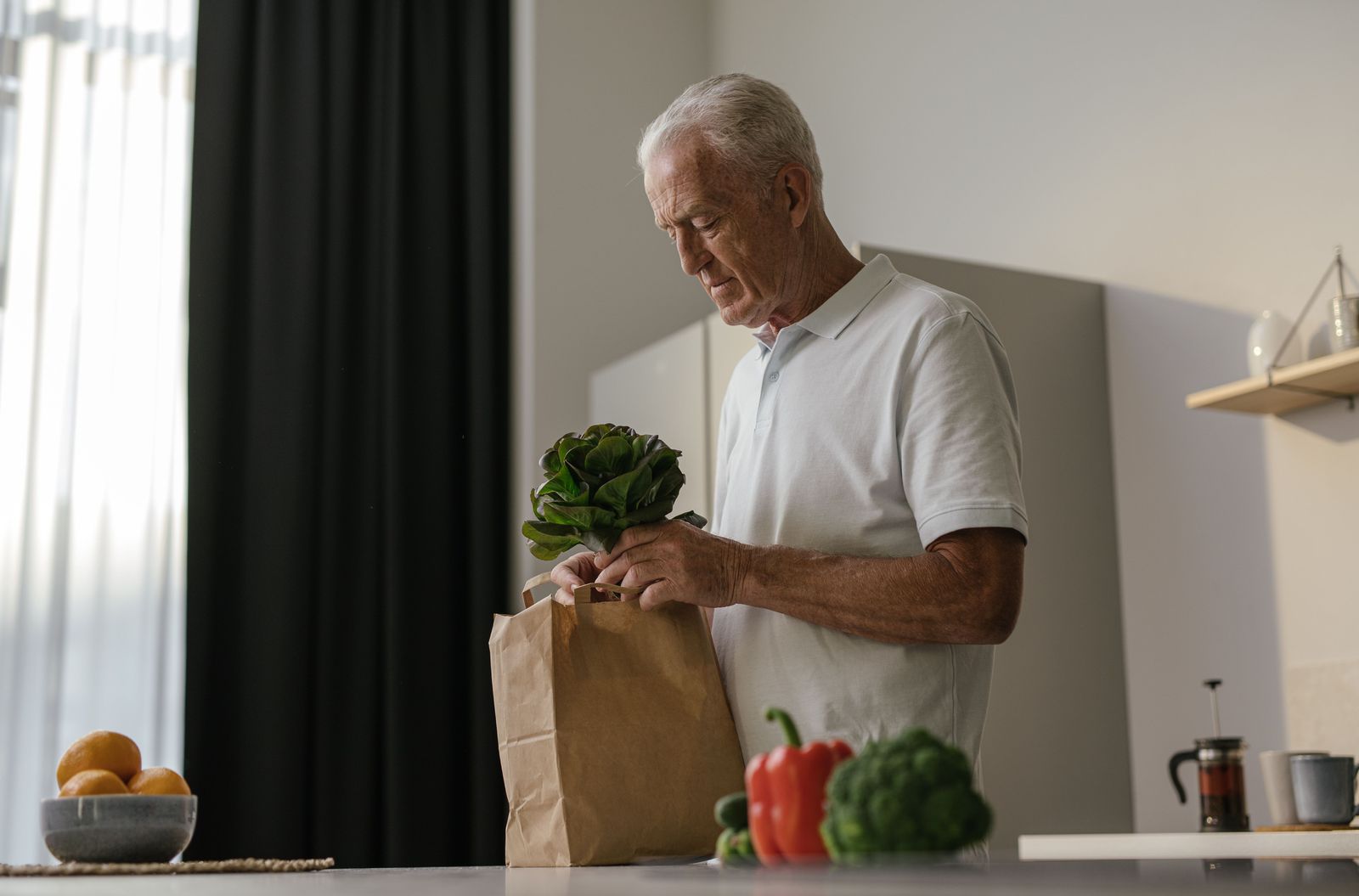 A middle-aged adult walking outdoors, representing midlife vascular health and cognitive aging research.