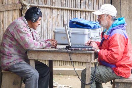 Researcher Ricardo Godoy conducts an experiment with a member of the Tsimane 