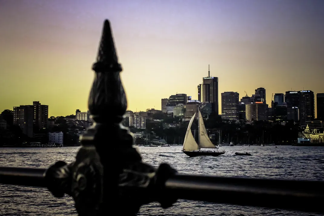 A sailboat goes down a river
