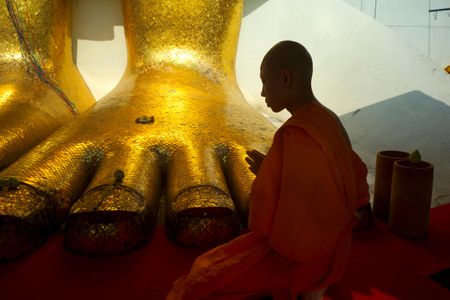 A Buddhist monk prays in a temple. Scientists recently discovered the mummified body of a Buddhist monk some say is in a long-term trance. 