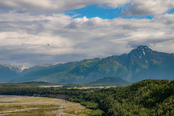 A Bush Plane Travels Through Pioneer Peak thumbnail