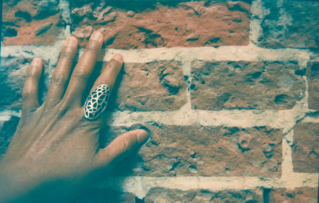 A brick interior wall on the second floor of the Strand building
