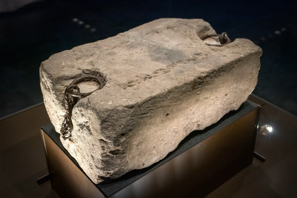 Large stone against black backdrop