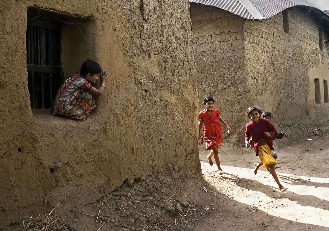 the playmates are enjoying their hide and seek game in their wonderful  village premises ., Smithsonian Photo Contest