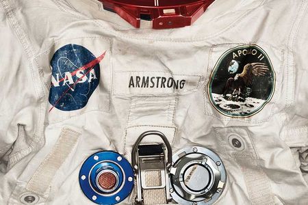 Armstrong’s pressurized spacesuit, measuring nearly 5 feet 7 inches tall, featured anodized aluminum gauges and valves. (Detail)