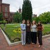Four interns stand for a picture in front of the Smithsonian Castle’s garden entrance.