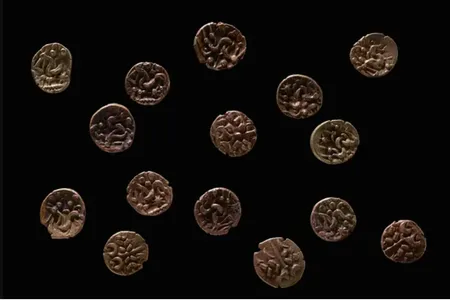 The coins depict the god Apollo on one side and a horse surrounded by symbols on the other.