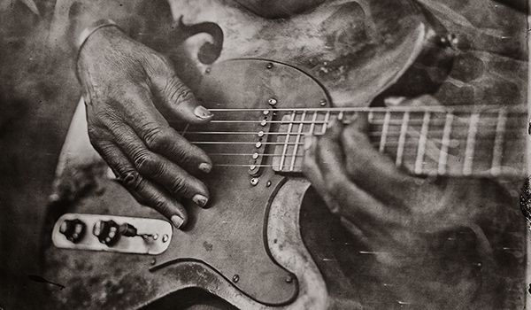 hands playing Vines' guitar mobile