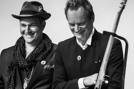 J. Ralph (left) and Sting (right), the night's honorees. Visible in the foreground is Sting's 1978 Stratocaster guitar, which is now a part of the Smithsonian collections.