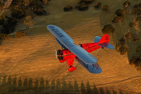 Waco vermillion with a gold-edged black stripe and silver wings: The airplane Chris Galloway flew in California last October wears the colors it did when Continental pilots flew it in Detroit in 1931.