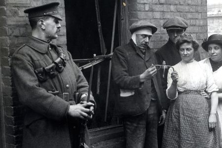 Examining a piece of a bomb dropped during a zeppelin raid, 1915.