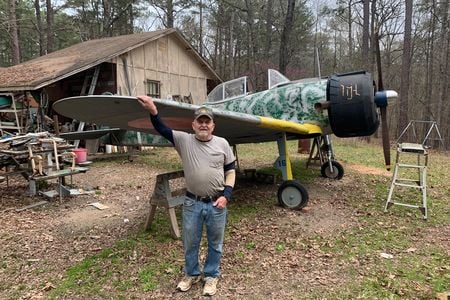 U.S. Army veteran Zeb Harrington stands with his nearly complete Japanese Oscar. The prop spinner was once a stainless-steel mixing bowl. What will he build next? “I always thought a Spitfire was a beautiful plane,” he says.