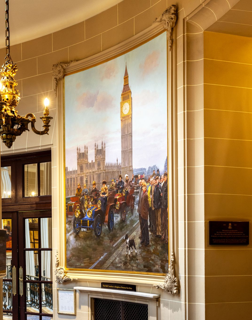 A mural in the RAC clubhouse shows an imagined scene on Westminster Bridge, with club members from different eras crossing in their antique cars.