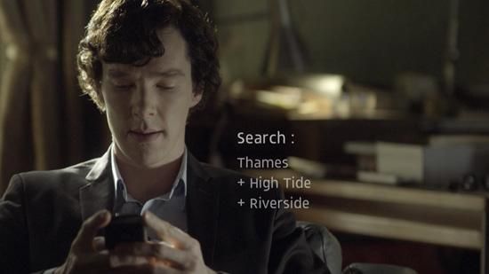 Benedict Cumberbatch as Sherlock Holmes searching for clues on his mobile phone