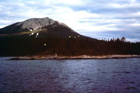 Earthquake lights seen Tagish Lake, in the Yukon Territory, in 1972. Large orbs are visible in the foreground, while smaller ones (highlighted by arrows) are seen higher up.