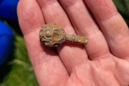 The gold object measures just four centimeters, or 1.5 inches, long.