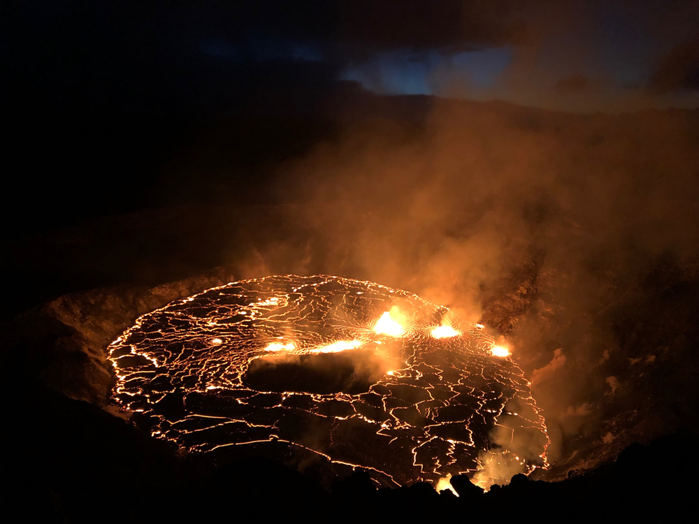 An image of the glowing red fissures inside of the Halema'uma'u Crater located on the Kīlauea volcano's summit