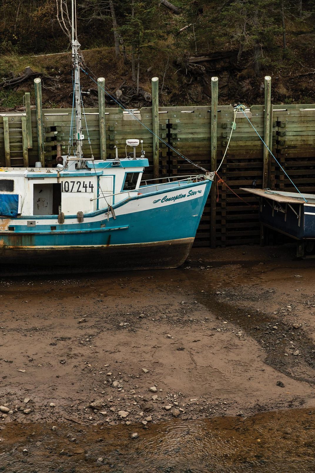 Boat at bay seawall 